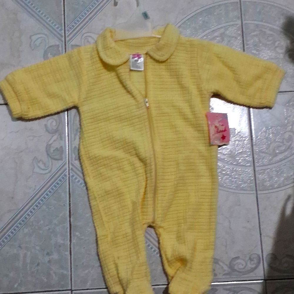 Yellow one piece baby bodysuit.